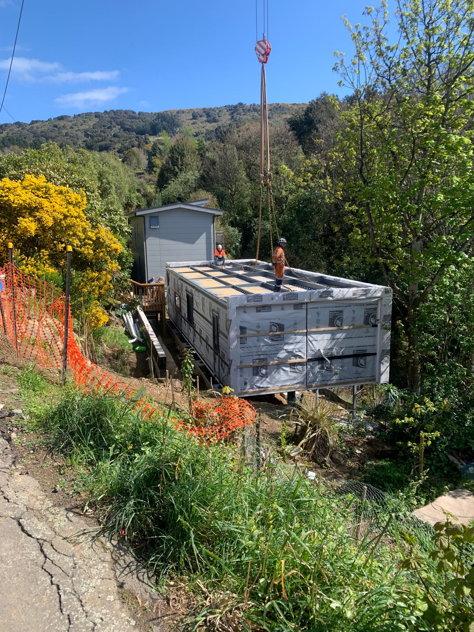 A house being lifted onto its site